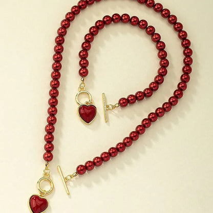 Set di gioielli con bracciale e collana di perle imitazione da 2 pezzi. Elegante ciondolo color perla, collare con perline di colore naturale per ragazza